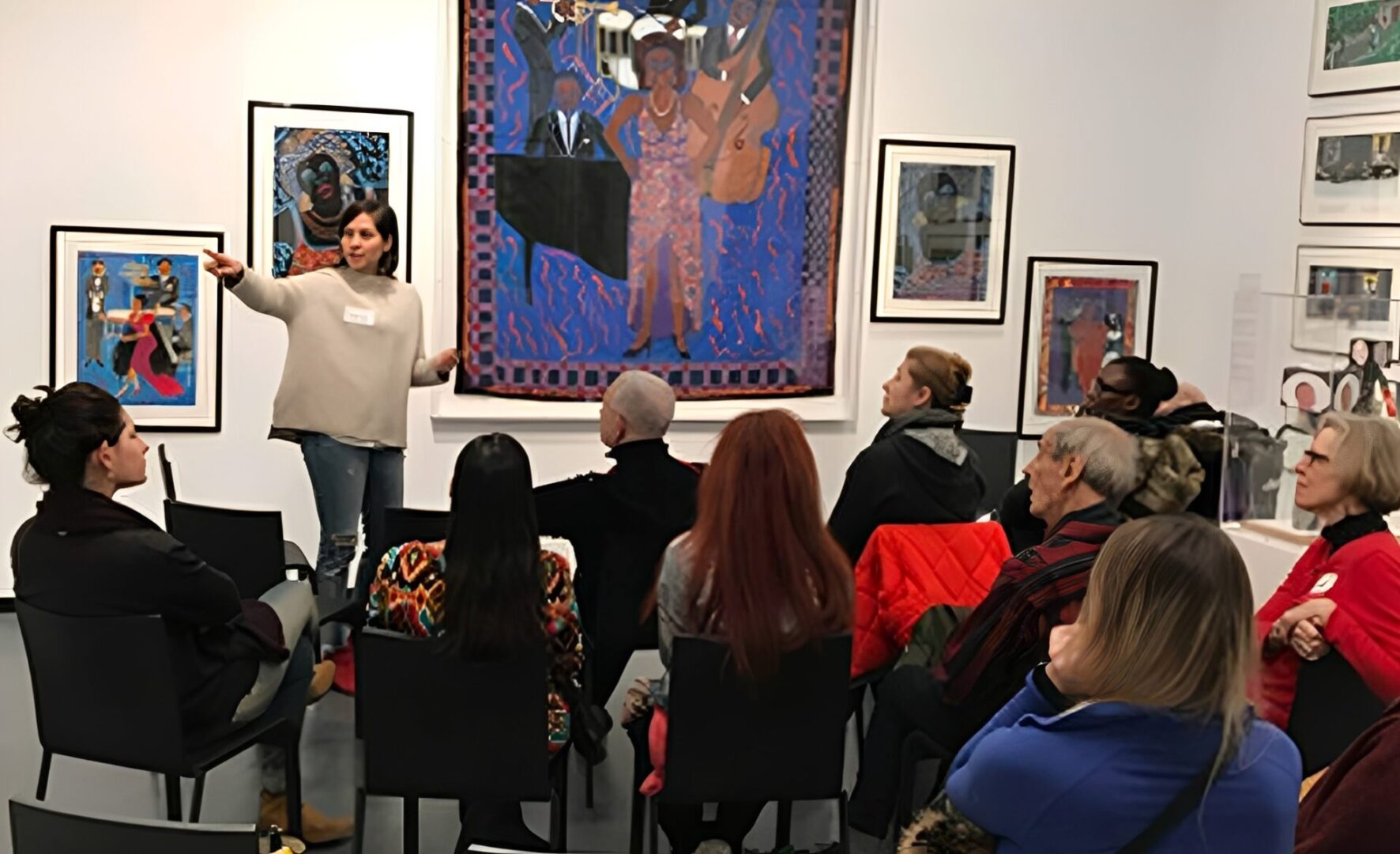 Woman leading art discussion in gallery