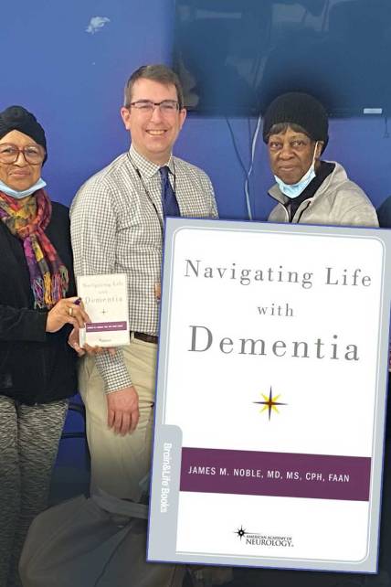 People holding dementia guide