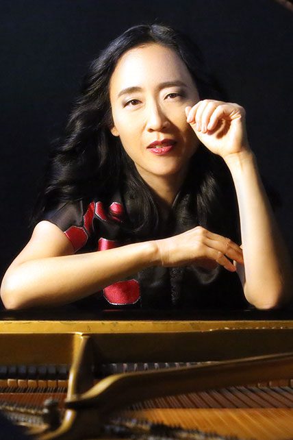 Pianist posing with hand on face