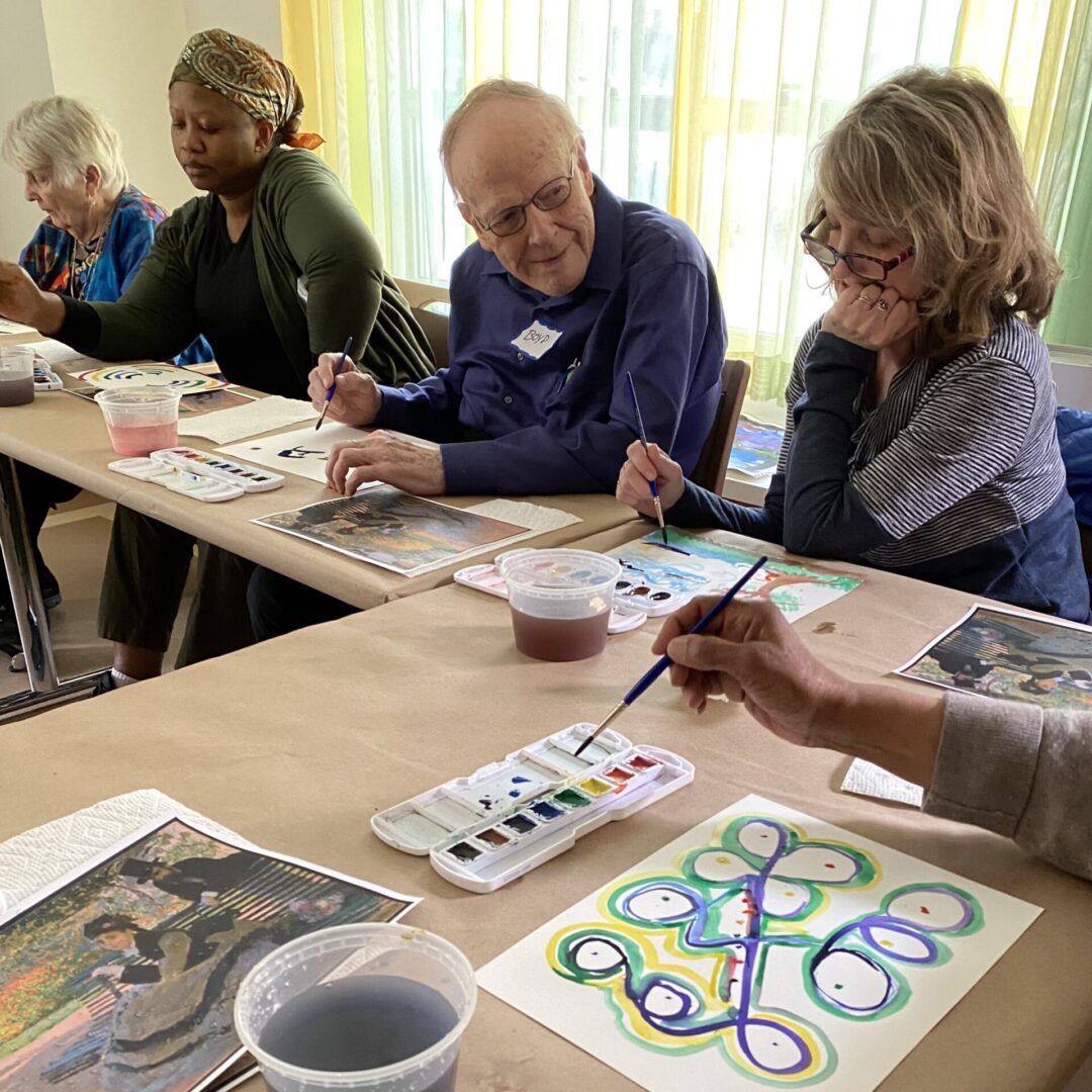 Group painting together in an art class.