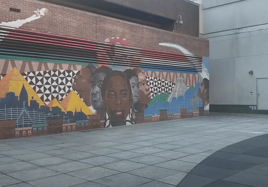Vibrant geometric and portrait mural