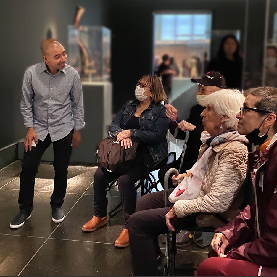 Group tour in a museum exhibit room.