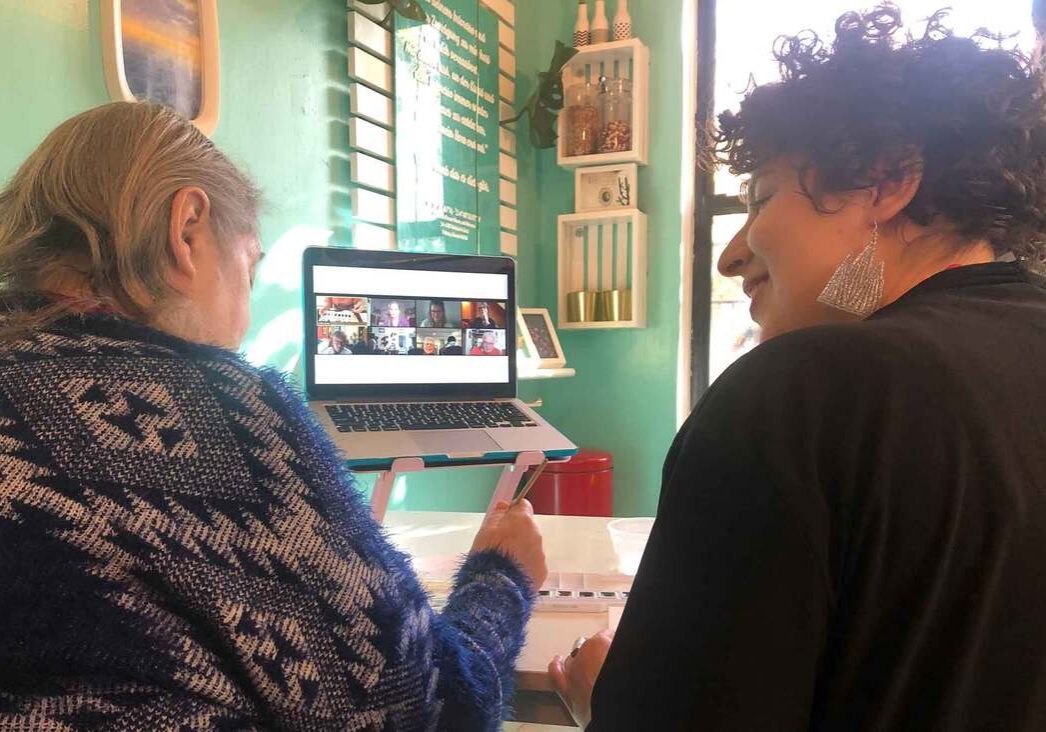 Two people video chatting on laptop